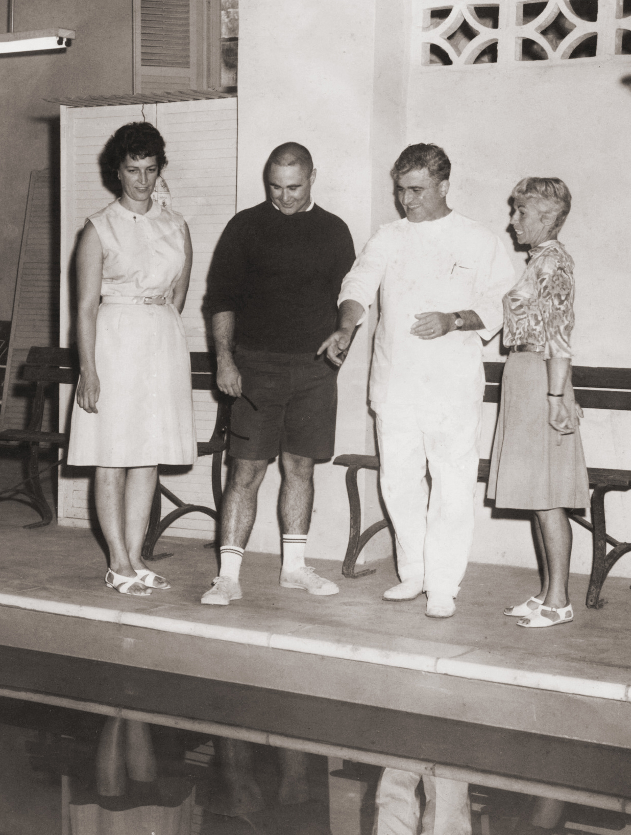 Dr. Arthur Zampella with visitors beside the pool at Idylease