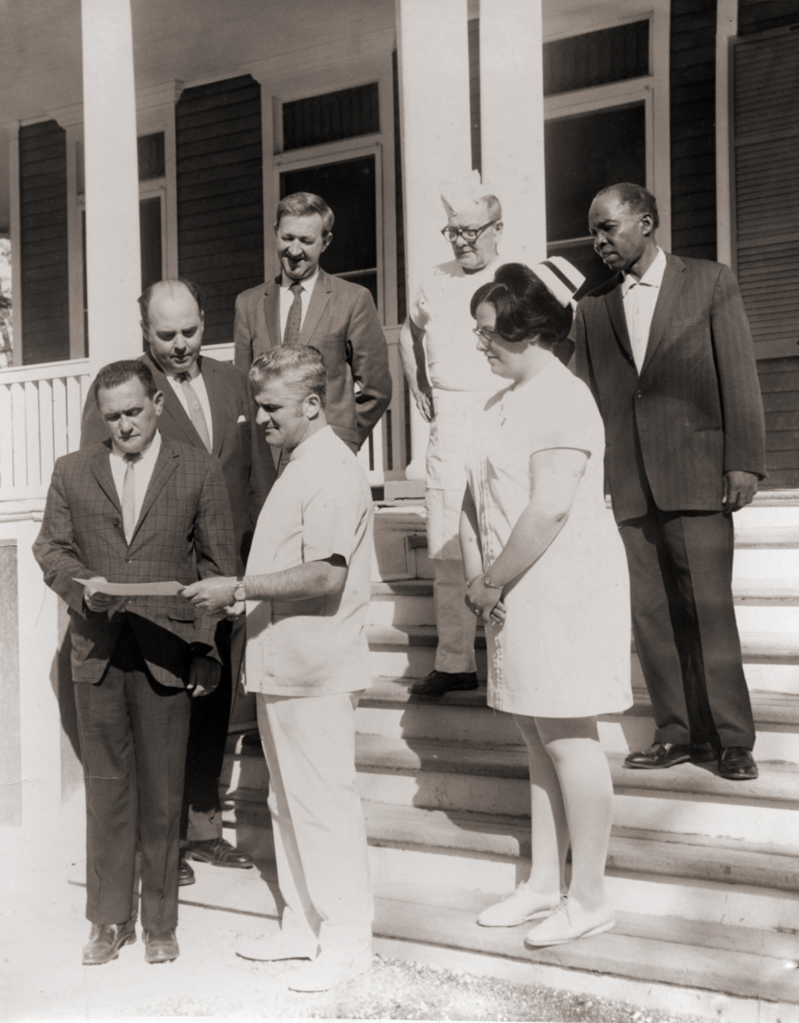Dr. Arthur Zampella with staff and colleagues on the steps at Idylease